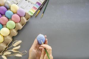 People painting colorful Easter eggs - Easter holiday celebration concept photo