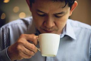 Business man eat the American breakfast set in a hotel - people take a breakfast in hotel concept photo