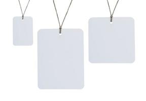 Blank tag tied for hang on product for show price or discount isolate on white background with clipping path photo