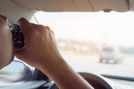 Man taking health drink while driving care for awake refreshment and robust drive - drive safe with some refreshment drink concept photo
