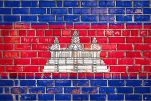 National  flag of the Cambodia  on a grunge brick background. photo