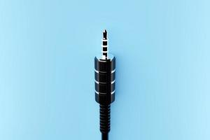 3.5 mm audio mini jack plug  isolated on a  blue  background.  3d  illustration photo