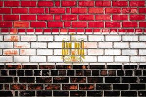 National  flag of the Egypt   on a grunge brick background. photo