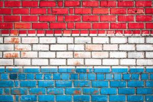 National  flag of the   Luxembourg  on a grunge brick background. photo