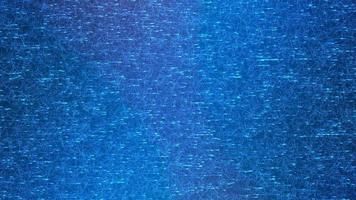 Abstract blue textured background with luminous particles