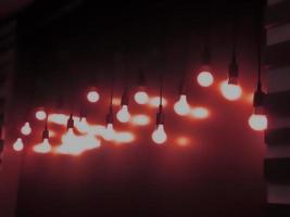 Open Light bulb on black background.add red color photo