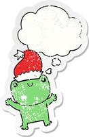 cute cartoon frog wearing christmas hat and thought bubble as a distressed worn sticker vector