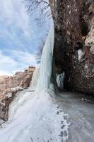 A large frozen waterfall. 3 cascading waterfall in Dagestan photo