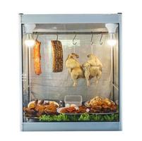 Thai food counter chicken and pork product cabinet in cafeteria isolated over white photo