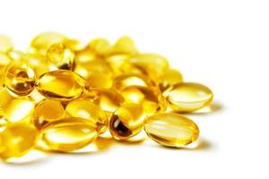 Vitamin D3, omega 3 fish oil supplement softgel capsules isolated on white background photo