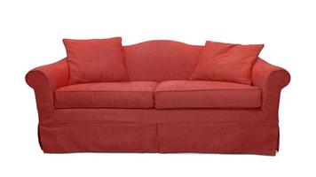 Red sofa with pillows isolated on white background. Red textile couch isolated photo