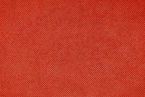 el fondo de textura de tela de tapicería de terciopelo rojo. foto