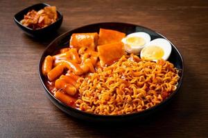 Korean instant noodles with Korean rice cake and fish cake and boiled egg photo