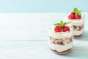 fresh raspberry and yogurt with granola photo