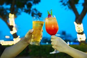 Couple celebration in restaurant with soft drink beer and mai tai or mai thai - happy lifestyle people with soft drink concept photo