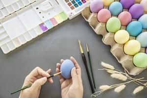People painting colorful Easter eggs - Easter holiday celebration concept photo