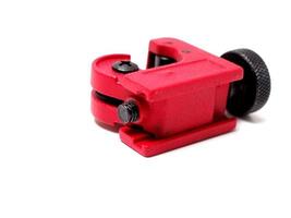 Picture of red mini pipe cutter that usually used by technician to cut small pipe. photo