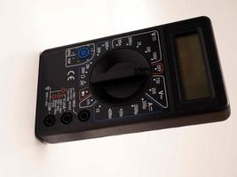 Picture of black digital multimeter or AVO meter for measuring electrical stuff such as voltage, resistance, and current photo