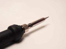 Close up shoot of soldering iron, a tool for soldering electrical components photo