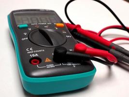 Picture of a digital multimeter, with red and black probe photo