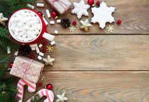 hot chocolate with marshmallows and gingerbread cookie photo