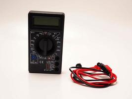 Picture of black digital multimeter or AVO meter for measuring electrical stuff such as voltage, resistance, and current photo