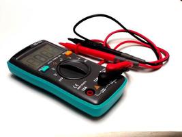 Picture of a digital multimeter, with red and black probe photo