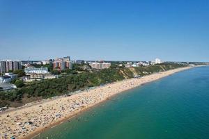 High Angle Sea View Beach Front with People at Bournemouth City of England UK, Aerial Footage of British Ocean photo