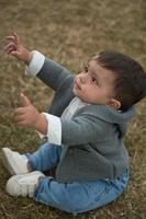 Cute Little Infant Baby is Posing at a Local Public Park of Luton Town of England UK photo