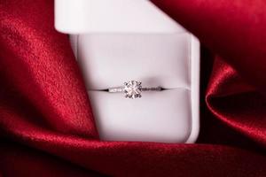 Diamond Wedding Ring Red Fabric photo