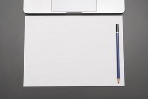 Office table Blank paper with pencil. The blank paper can be used to put some text or images. photo
