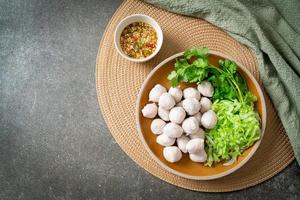 pork meatball with vegetable and spicy sauce photo