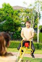 Asian couple love play seesaw photo