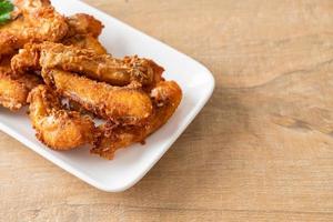 Fried Snapper Belly on white plate photo