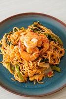 Stir-fried instant noodles sukiyaki with shrimps photo