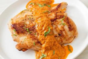 grilled chicken steak with red curry sauce photo