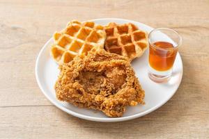 fried chicken waffle with honey or maple syrup photo