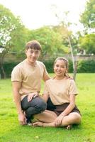 Asian couple love dating in park photo