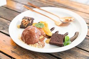 chocolate ice-cream with chocolate brownie and caramel banana photo