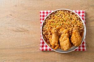 Korean instant noodles with fried chicken or Fried chicken ramyeon photo