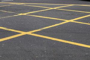 Different signs and marking painted on the ashpalt of streets and roads. photo