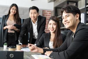 Happy group of businesspeople during presentation. Business people working as a team at the office photo