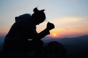 woman worship on sunset photo