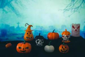 Spooky cemetery with glow halloween pumpkin photo