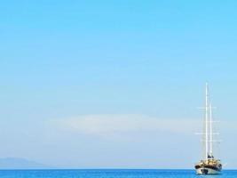 A large junk boat in the middle of the sea photo