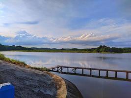 Wooden bridge over lake photo