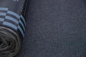 Waterproof bitumen roll covered with insulation materials. photo