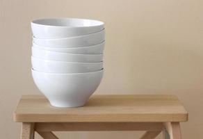 stack of white bowl on table photo
