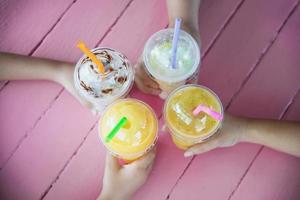 People enjoy celebration with cold blended juicy fruit drink cup - people happy lifestyle with colorful drink concept photo