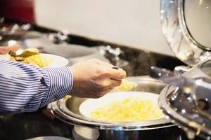 Business man eat the American breakfast set in a hotel - people take a breakfast in hotel concept photo